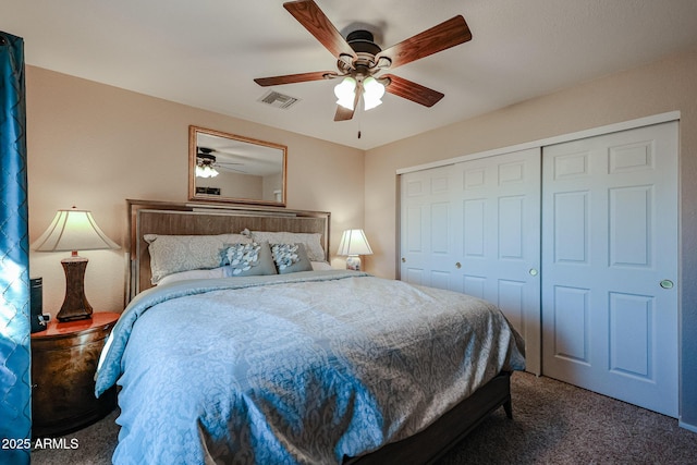 bedroom with ceiling fan, a closet, and dark colored carpet