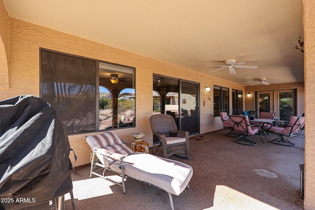 view of patio with ceiling fan and grilling area