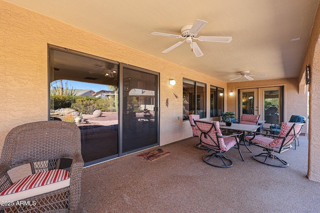 view of patio / terrace featuring ceiling fan