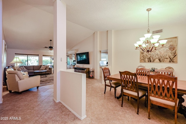 dining area with high vaulted ceiling, light tile patterned flooring, and ceiling fan with notable chandelier