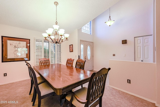 dining space with light tile patterned floors, a chandelier, and a healthy amount of sunlight