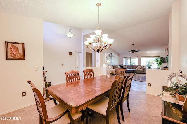 dining space featuring a textured ceiling, light tile patterned floors, lofted ceiling, and a chandelier