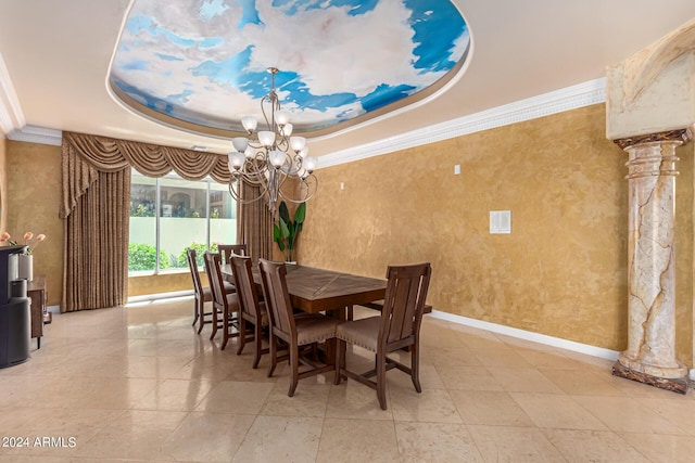 dining area with a raised ceiling, ornamental molding, decorative columns, and a chandelier