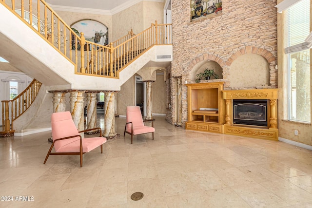 interior space featuring crown molding and a high ceiling