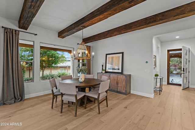 dining room featuring beamed ceiling, a chandelier, and light wood-type flooring