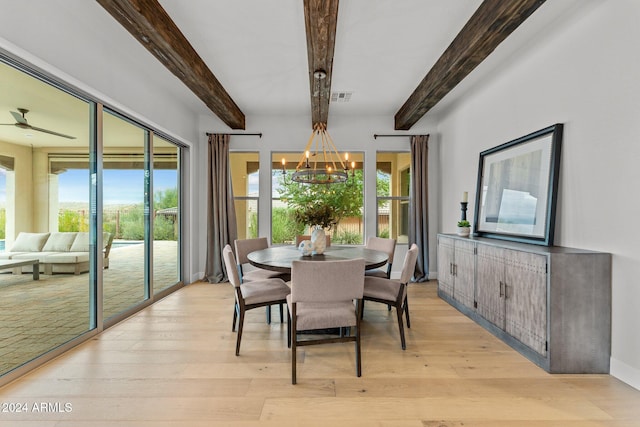 dining area featuring light hardwood / wood-style flooring, beam ceiling, and ceiling fan with notable chandelier