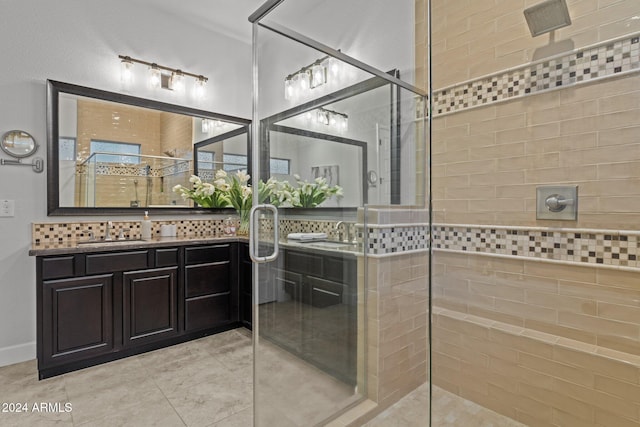 bathroom with vanity and an enclosed shower