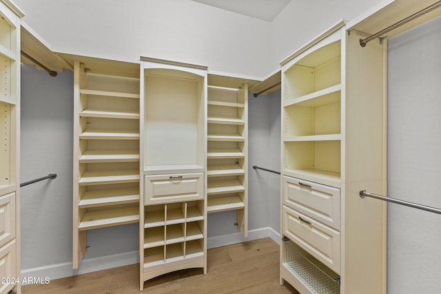 spacious closet featuring light hardwood / wood-style floors