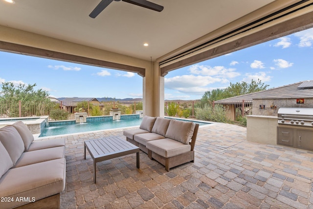 view of patio / terrace with area for grilling, grilling area, outdoor lounge area, pool water feature, and ceiling fan