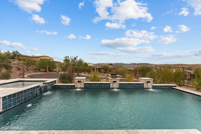 view of pool with pool water feature