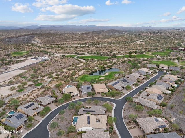 aerial view featuring a water and mountain view