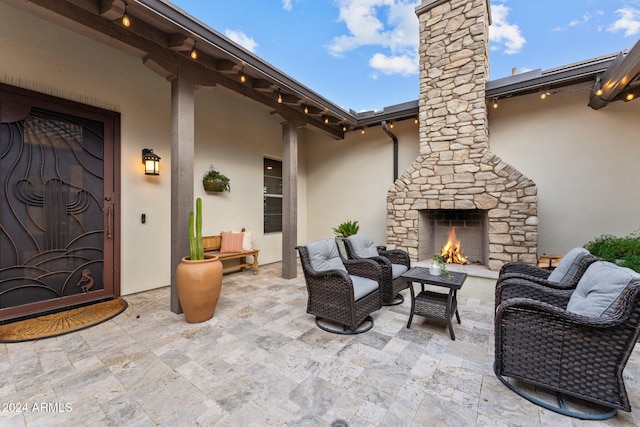 view of patio with an outdoor stone fireplace