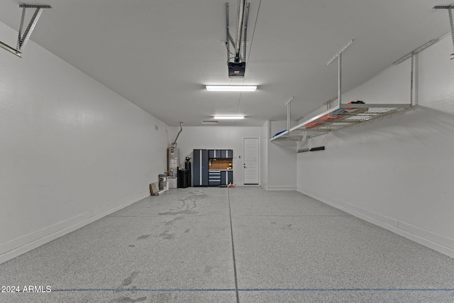 garage with water heater and a garage door opener