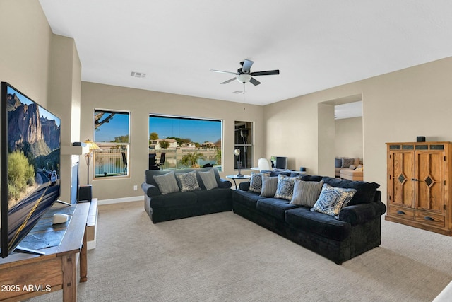 living room with light carpet and ceiling fan