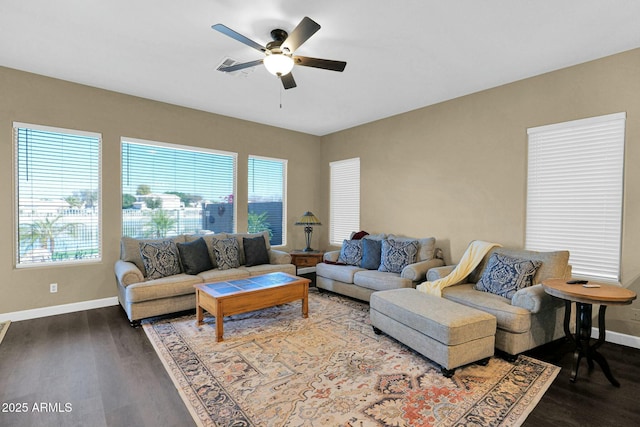 living room featuring wood-type flooring, plenty of natural light, and ceiling fan