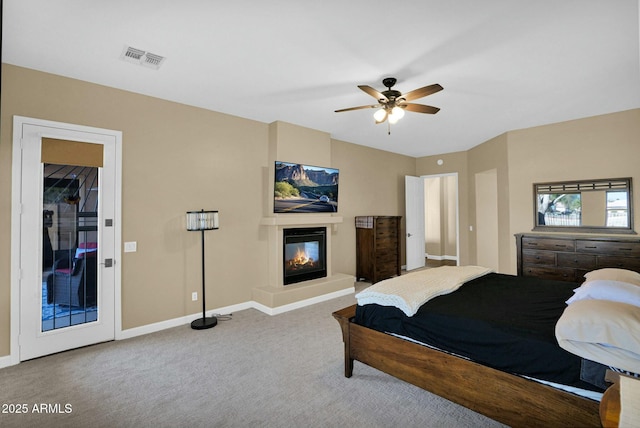 bedroom with ceiling fan and carpet flooring