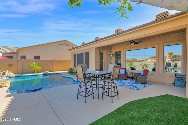 view of pool with ceiling fan and a patio