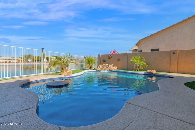 view of swimming pool featuring a water view