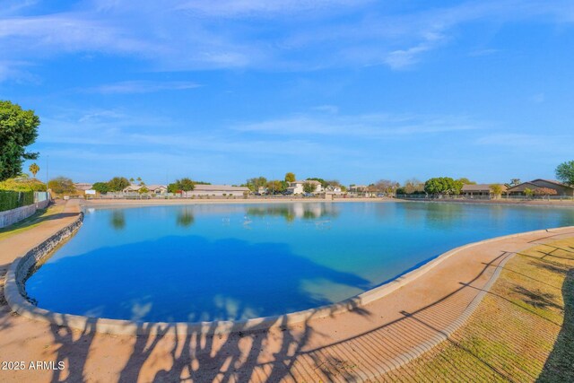 view of pool featuring a water view