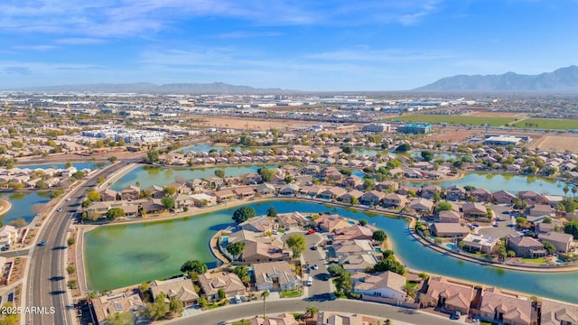 birds eye view of property with a water and mountain view