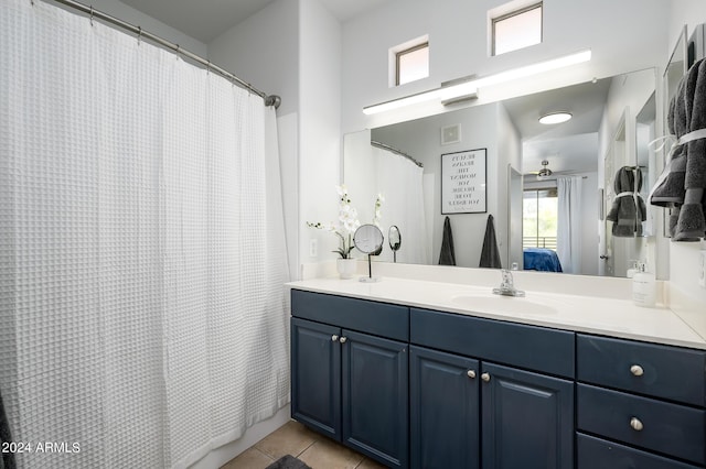 bathroom with tile patterned flooring and vanity