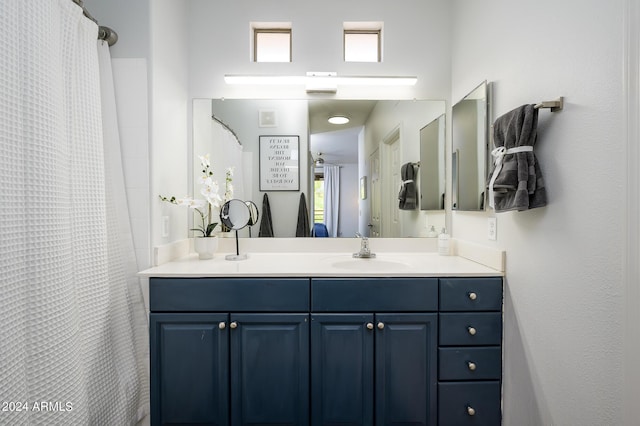 bathroom with vanity and a healthy amount of sunlight