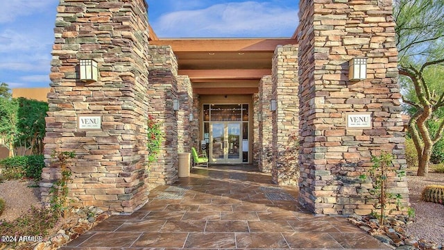 view of exterior entry featuring french doors