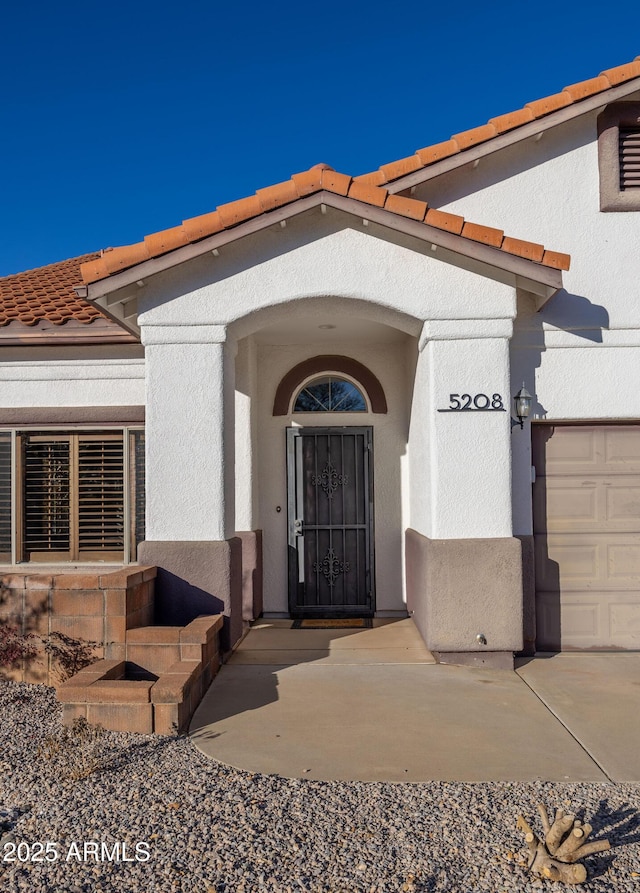 entrance to property featuring a garage