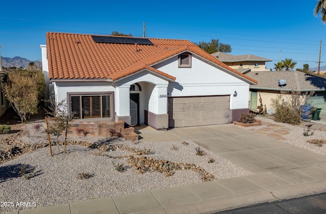 view of front of property with solar panels