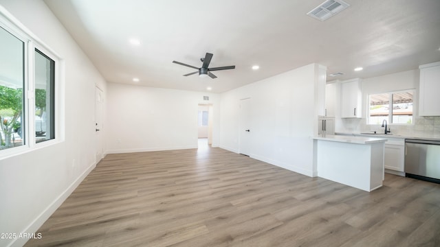 1838 E Earll Dr, Phoenix, AZ 85016 - kitchen with white cabinets, recessed lighting, light countertops, dishwasher, and visible vents
