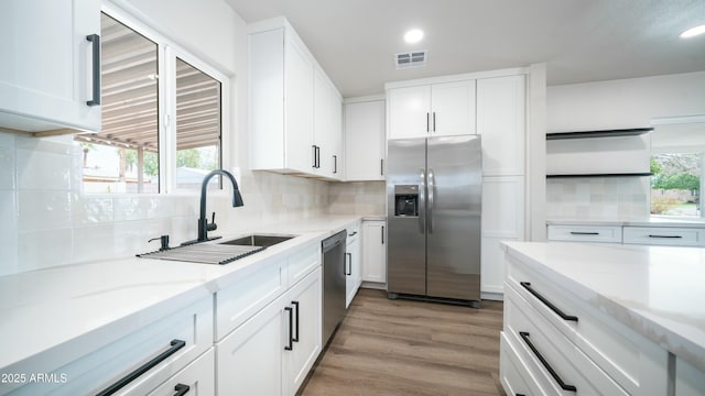 1838 E Earll Dr, Phoenix, AZ 85016 - kitchen featuring white cabinetry, appliances with stainless steel finishes, a sink, and visible vents