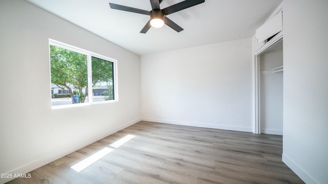 1838 E Earll Dr, Phoenix, AZ 85016 - unfurnished bedroom featuring wood finished floors, a closet, baseboards, and ceiling fan