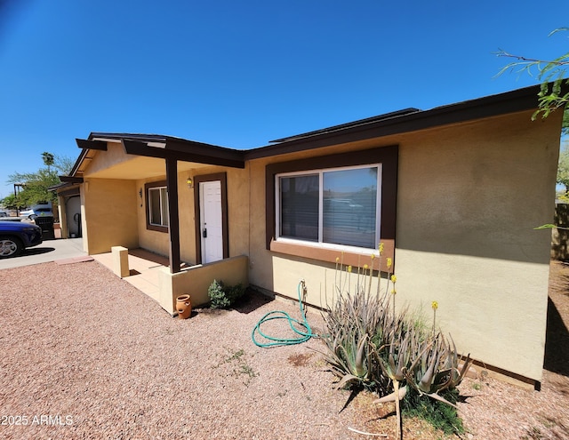 view of front of home featuring stucco siding