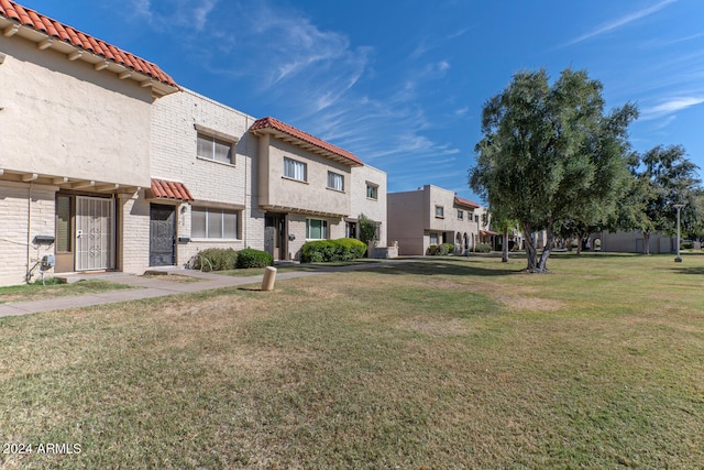 view of community featuring a lawn