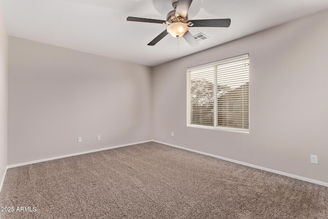 empty room featuring ceiling fan and carpet flooring