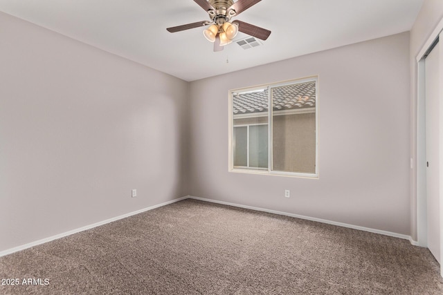 unfurnished room with carpet and ceiling fan