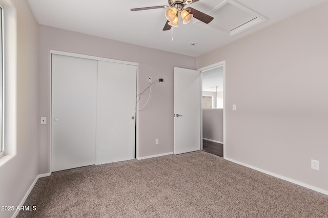 unfurnished bedroom with a closet, ceiling fan, and carpet flooring