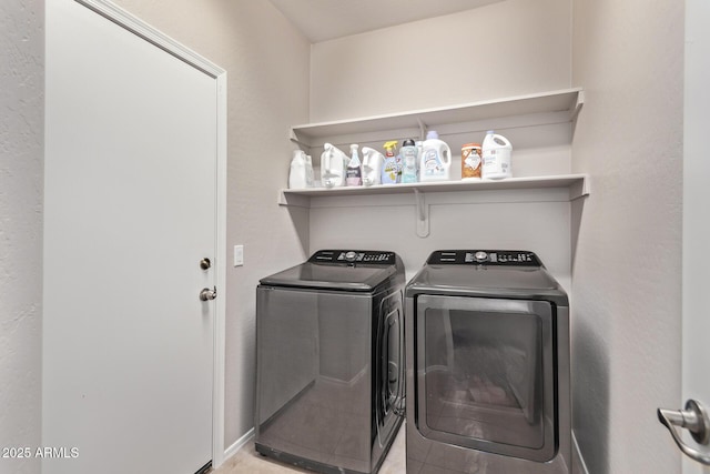 clothes washing area featuring washing machine and dryer