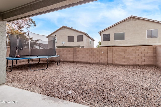 view of yard with a trampoline