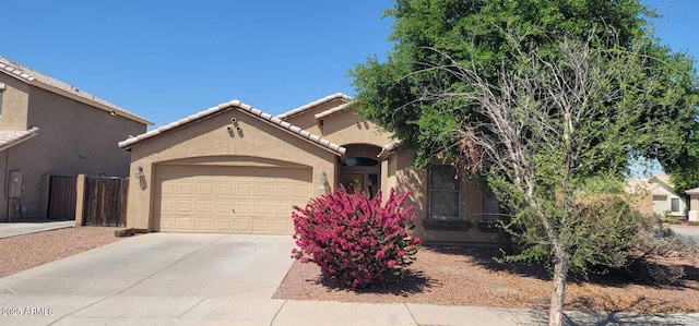 2202 S 82nd Ave, Phoenix, AZ 85043 - view of front facade with stucco siding, an attached garage, concrete driveway, and a tile roof