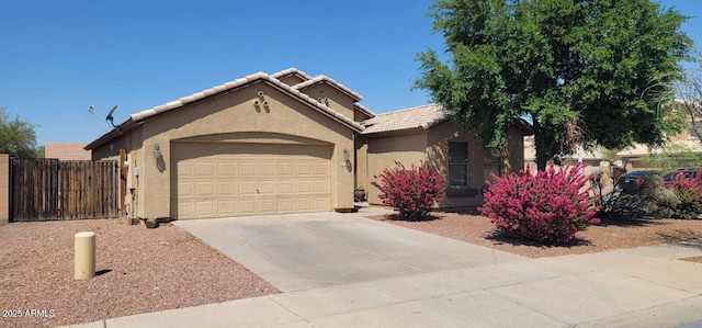 2202 S 82nd Ave, Phoenix, AZ 85043 - view of front facade with an attached garage, stucco siding, concrete driveway, and a tiled roof