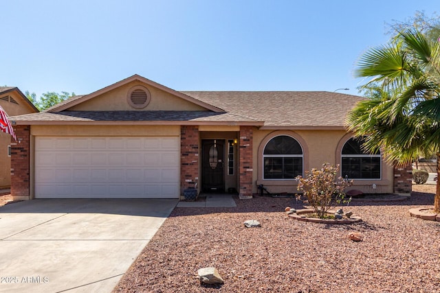 single story home with roof with shingles, brick siding, stucco siding, an attached garage, and driveway