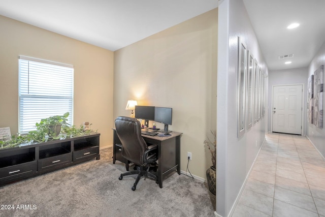 office space with light tile patterned floors