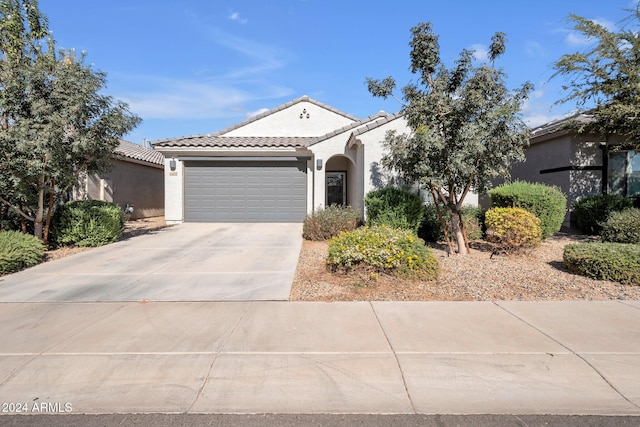 mediterranean / spanish-style house featuring a garage