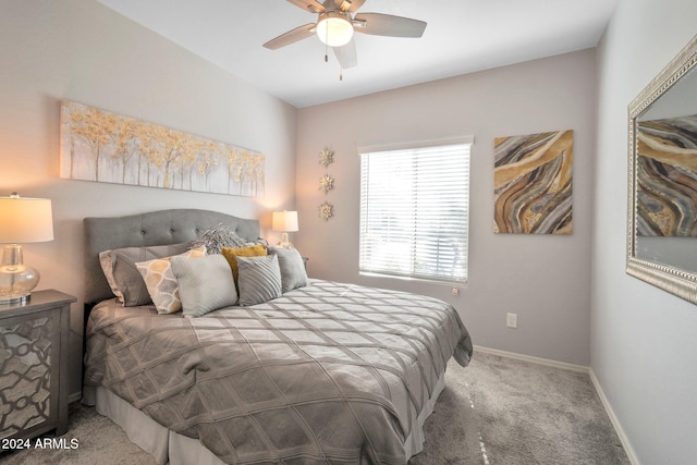 bedroom featuring ceiling fan and carpet