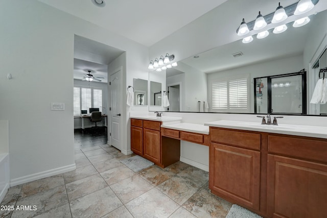 bathroom with vanity, ceiling fan, and a shower with shower door