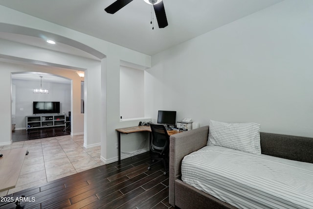 bedroom with hardwood / wood-style flooring and ceiling fan