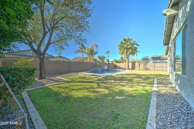 view of yard with a fenced in pool