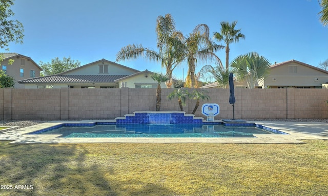 view of swimming pool with a lawn