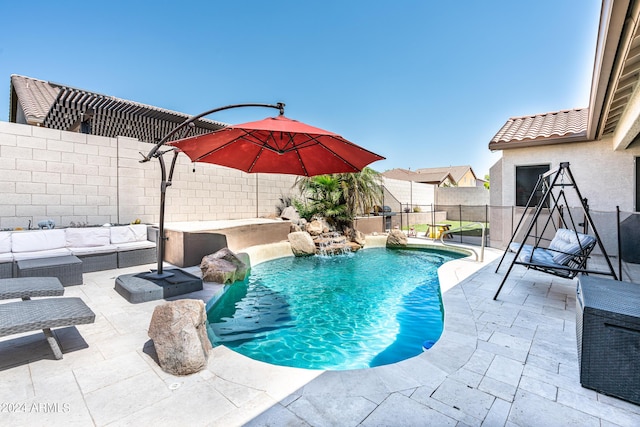 view of swimming pool with an outdoor living space, a patio area, a fenced in pool, and a fenced backyard